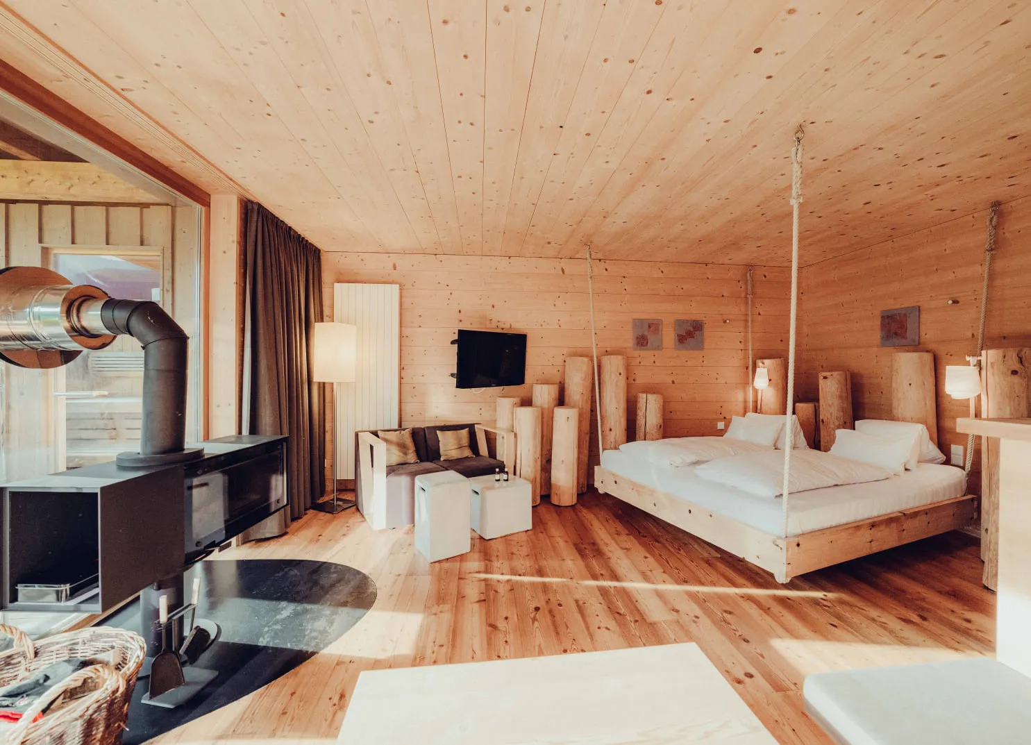 Wooden room with bed, TV and modern furnishings