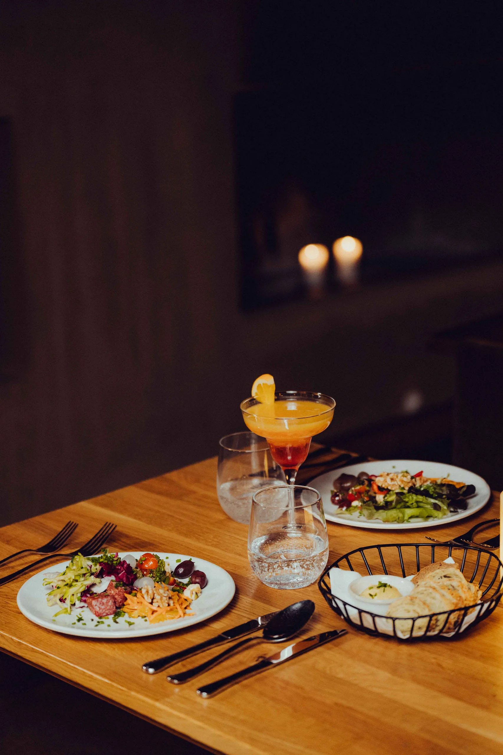 Table with various dishes and drinks at Holzhotel Forsthofalm