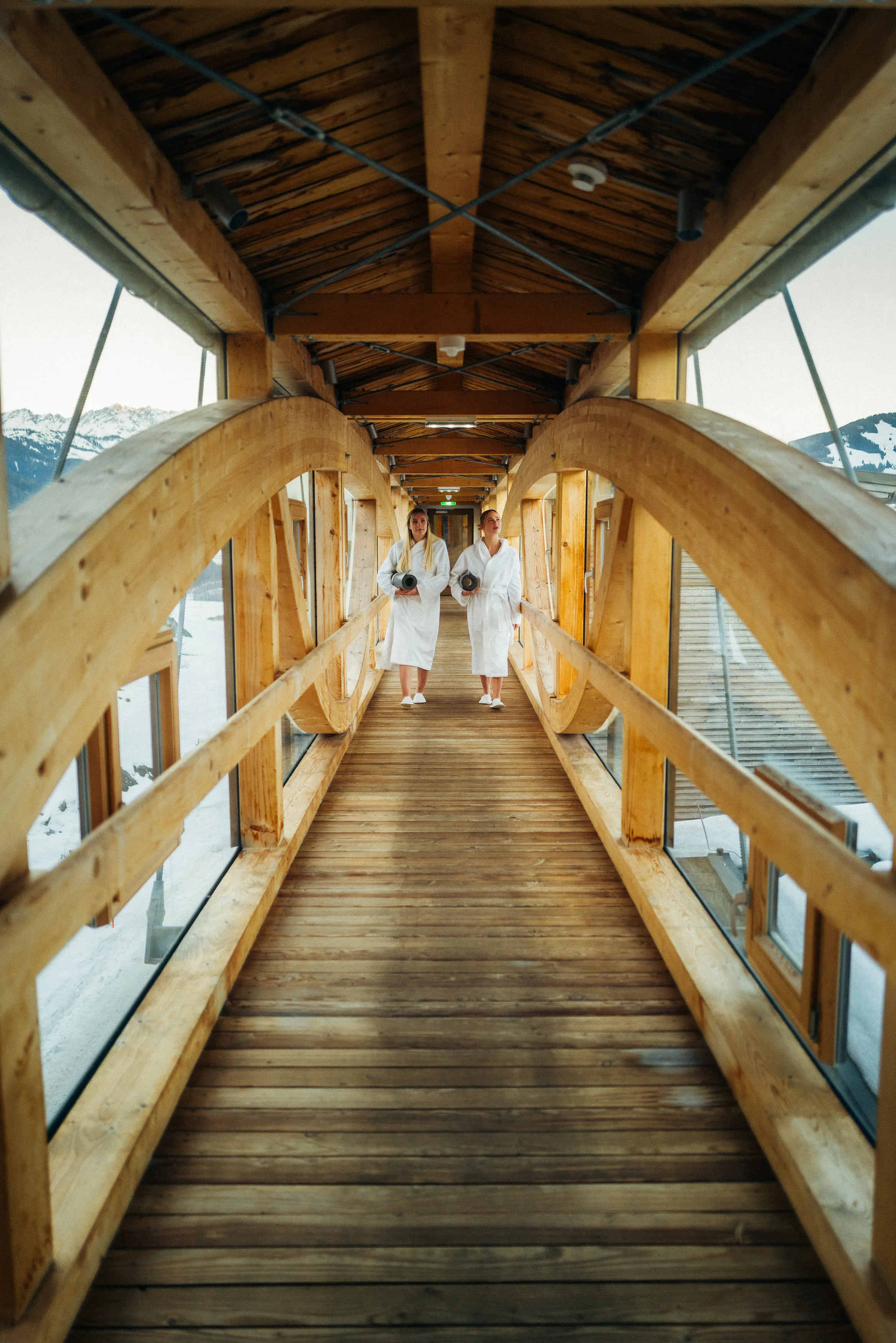 Wooden walkway with two people in bathrobes