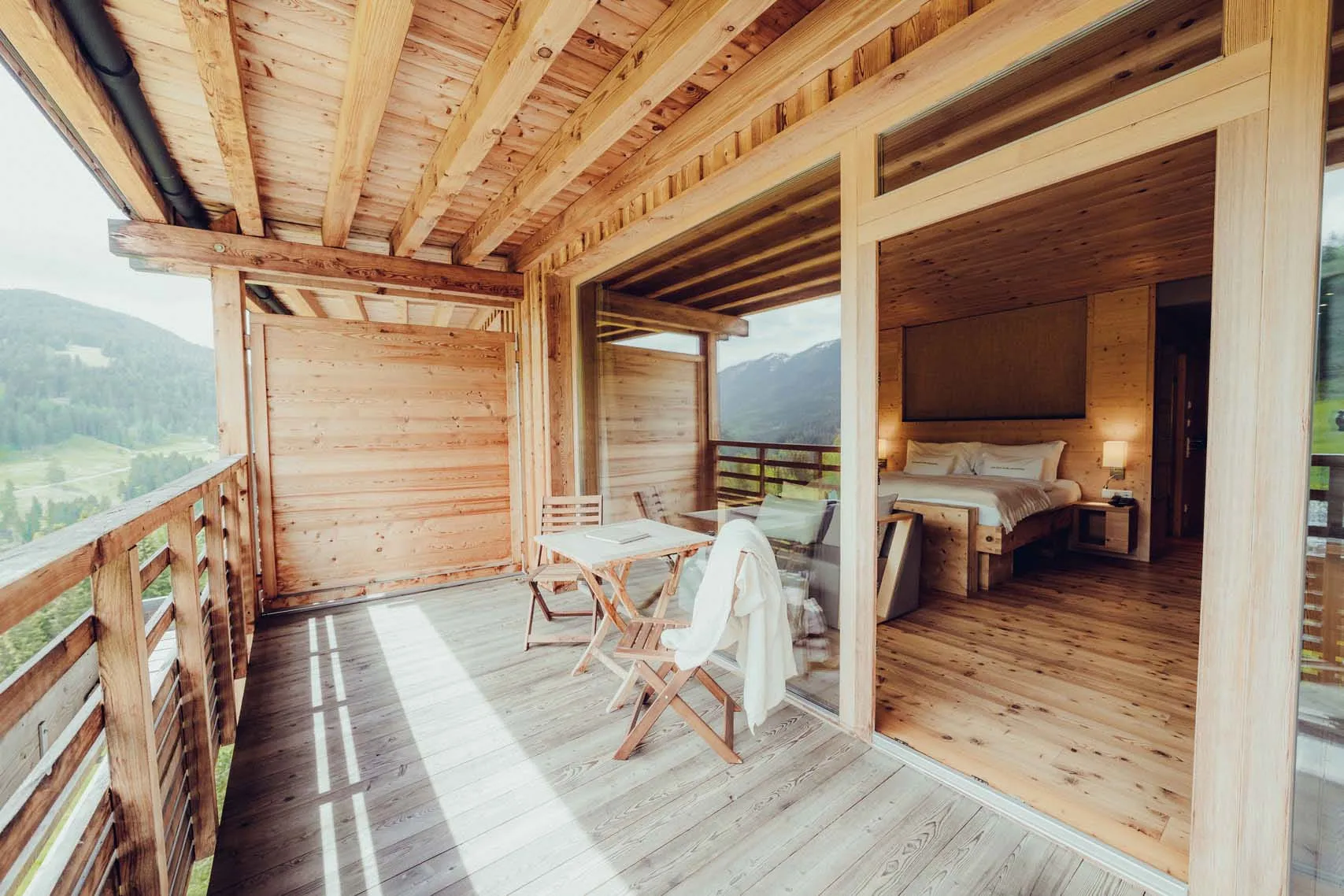 Holzhotel Forsthofalm in Leogang, wooden room with terrace and view
