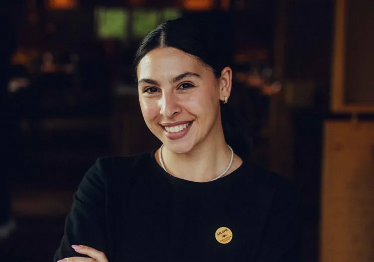 Smiling woman in a wooden hotel
