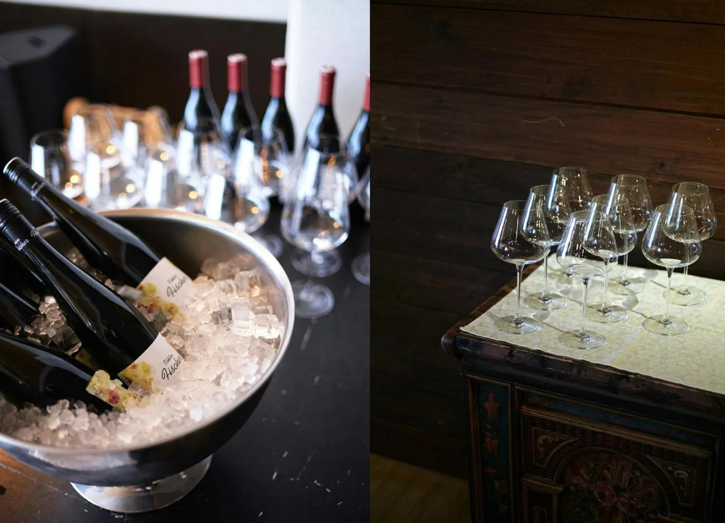 Bottles of wine in ice with wine glasses on a tabletop