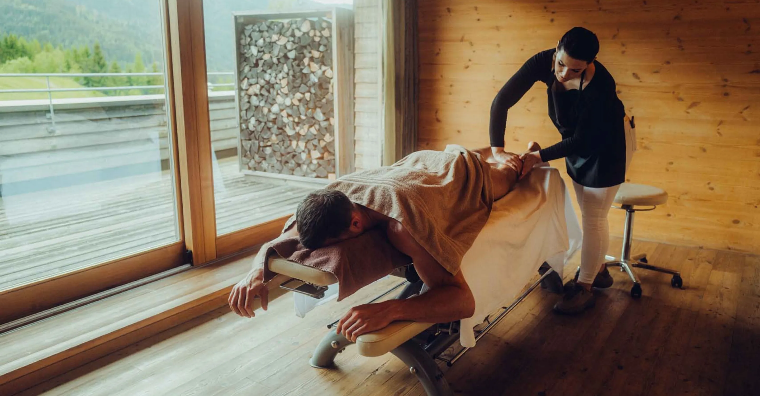 Man receiving a massage in a modern room.