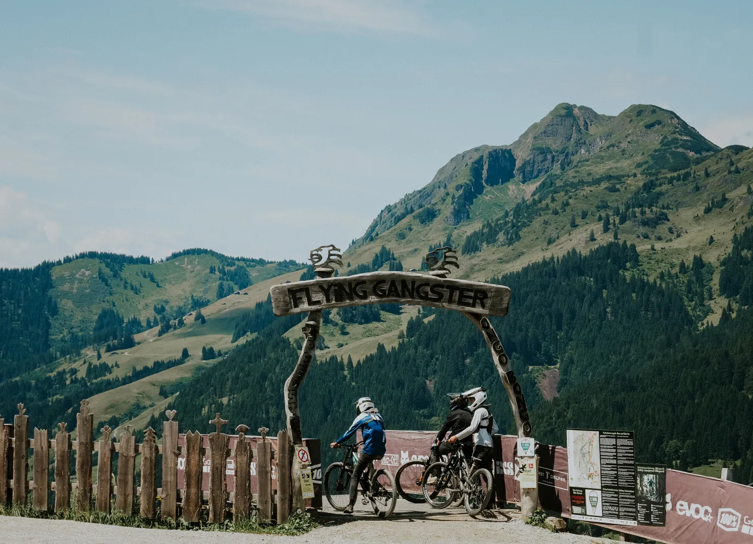 Cyclists under the Flying Gangster trail arch.